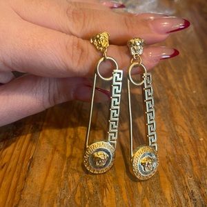 Gold safety pin style long earrings. Never worn.